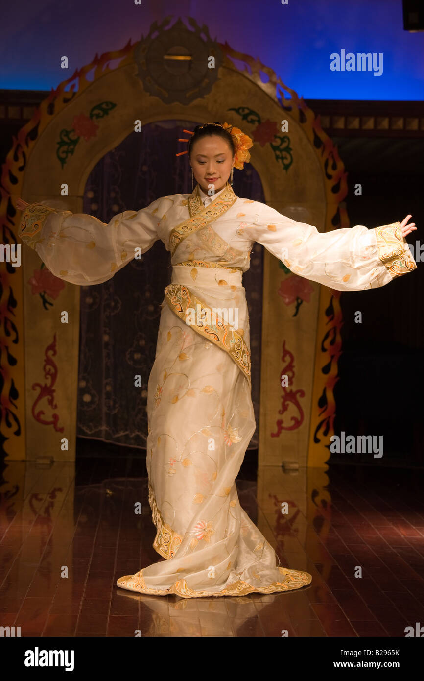 Dancer performing traditional show on Victoria Line Cruise Ship for Western tourists Yangtze River China Stock Photo