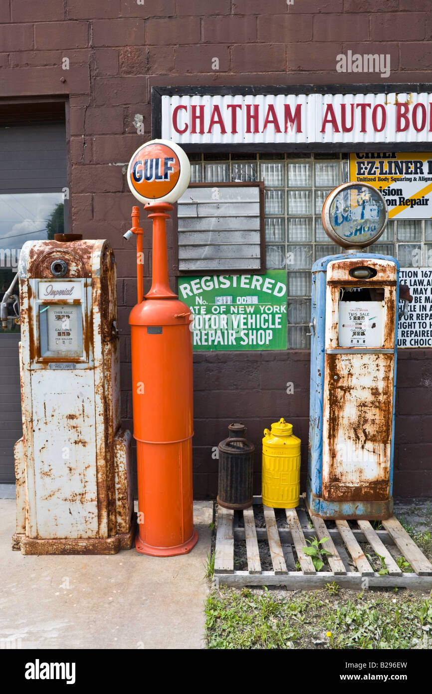 collection of old gas petrol pumps, Chatham auto body repair, Chatham, New York, USA Stock Photo