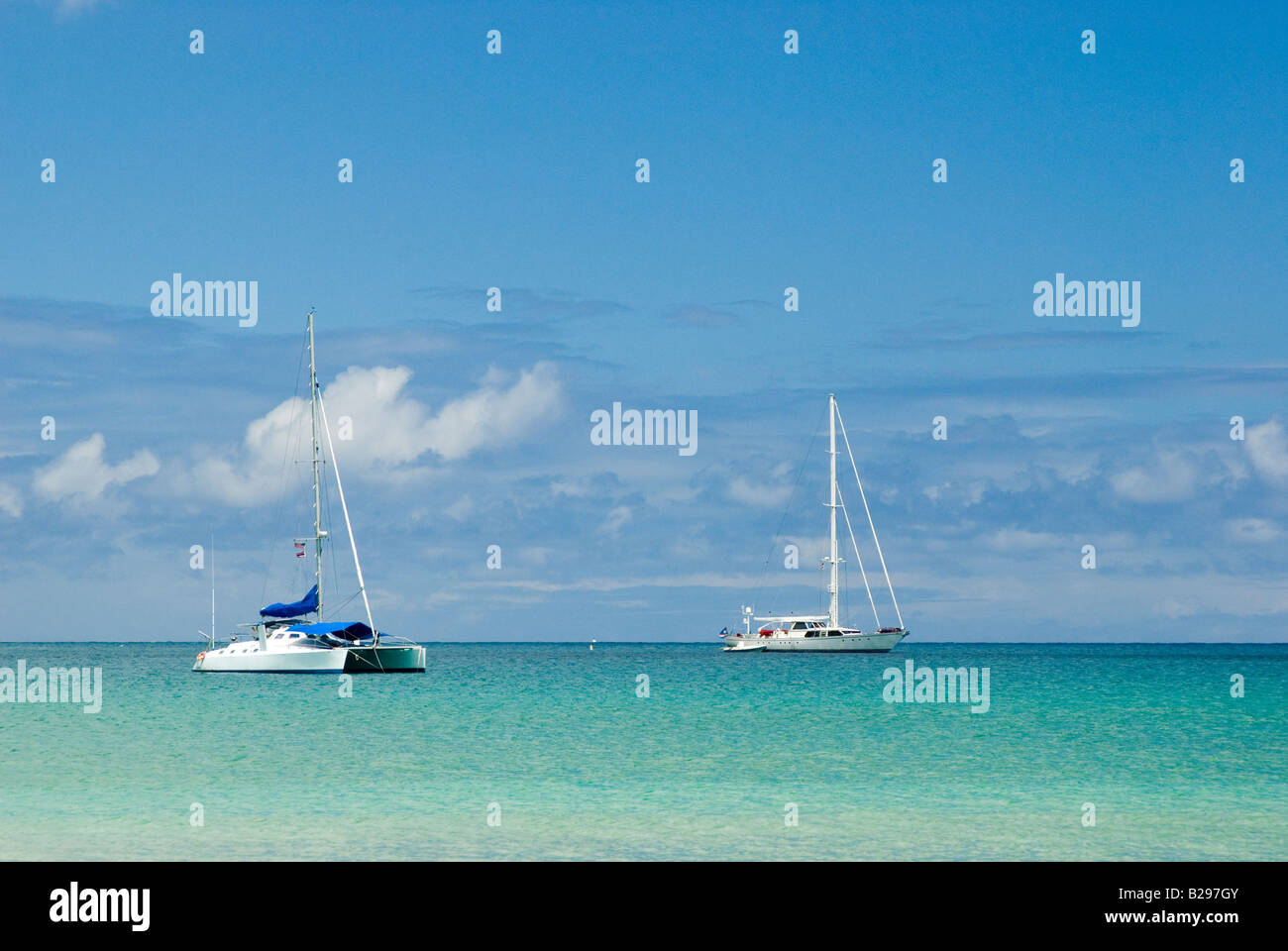 A sailboat and a catamaran anchored in Hanalei Bay which is on the north side Kauai Hanalei Bay