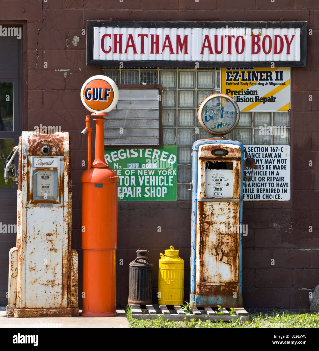 collection of old gas petrol pumps, Chatham auto body repair, Chatham, New York, USA Stock Photo