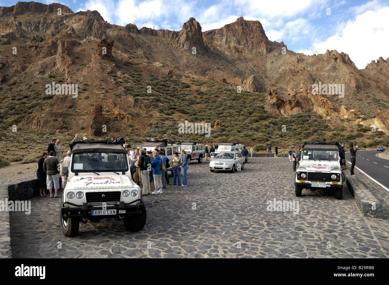 Tourists with jeeps Stock Photo