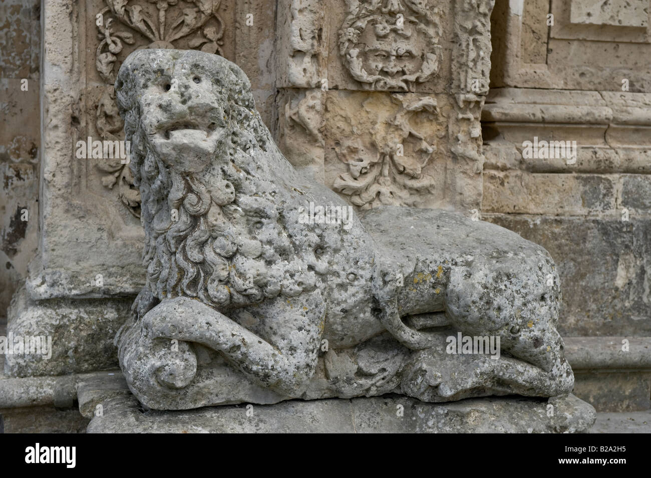 Stone lion in front of St Sebastian Church Stock Photo