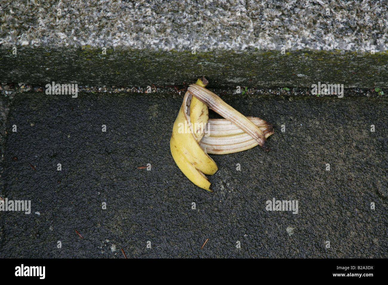Discarded banana skin on roadside Stock Photo