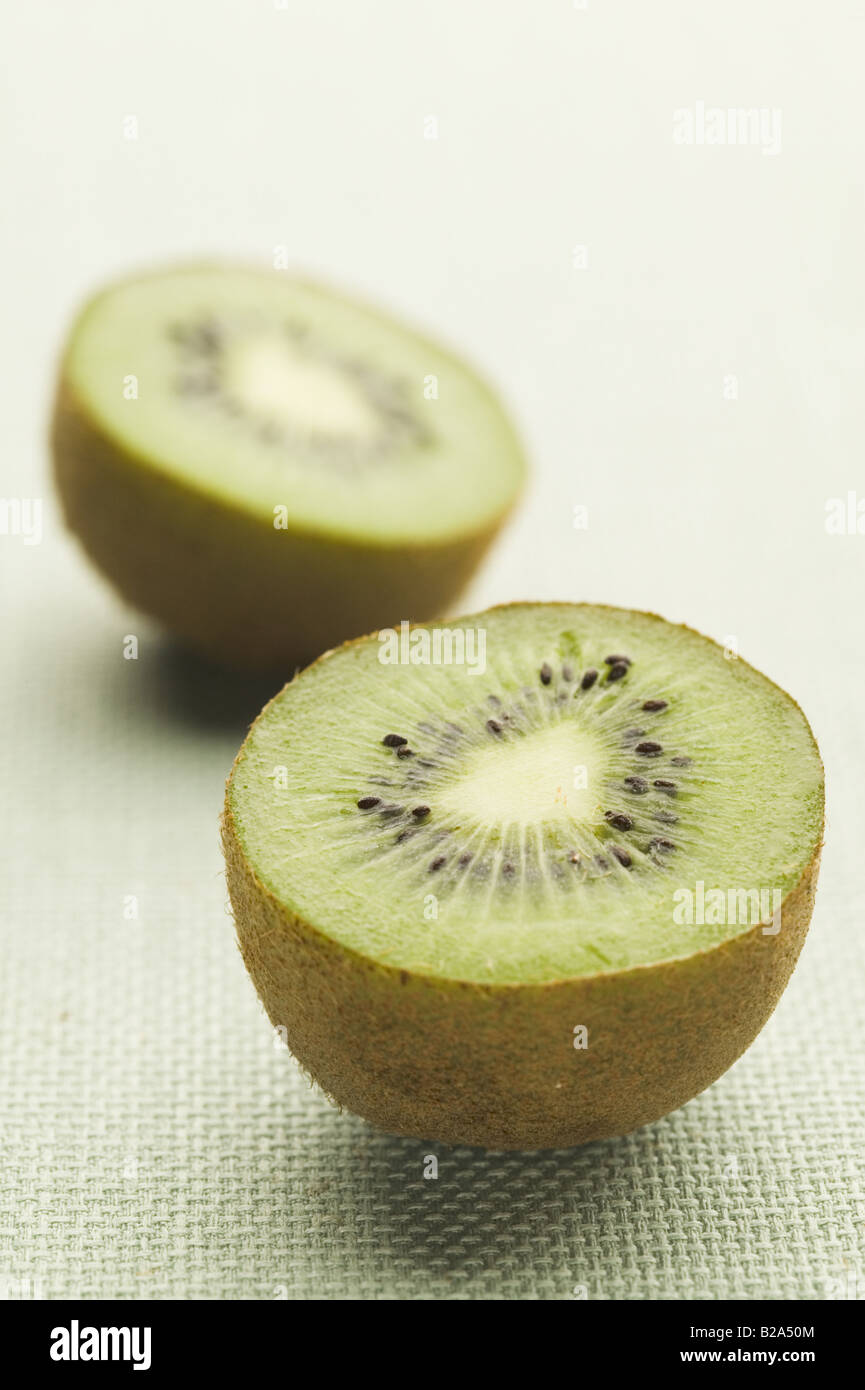 A kiwi fruit cut in half Stock Photo Alamy