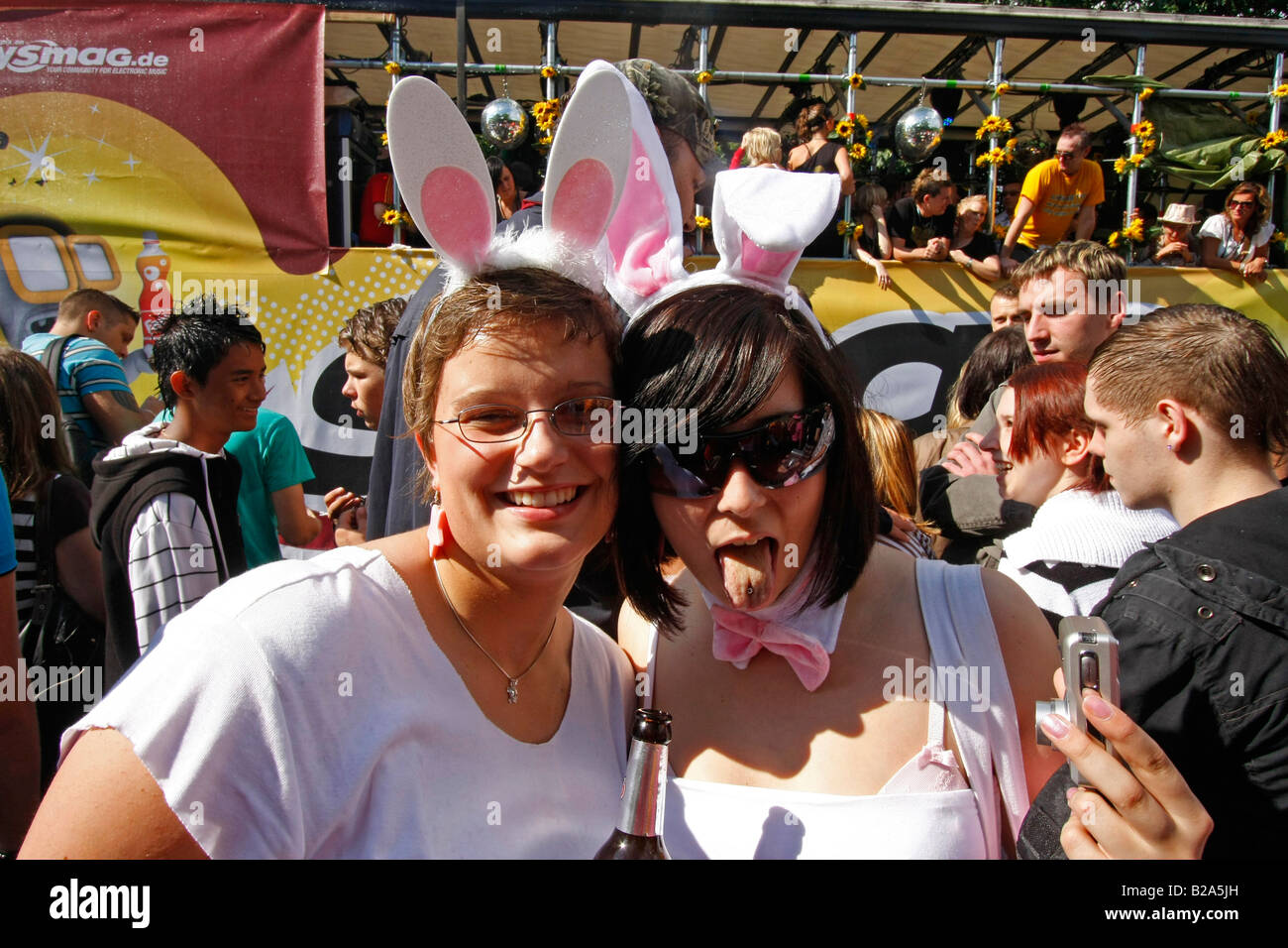 girls posing with bunny ears at The Love Parade 2008 in Dortmund Germany Stock Photo