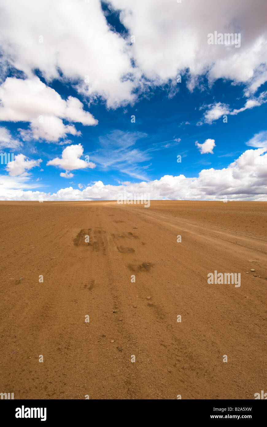 desert road white clouds and deep blue sky Stock Photo - Alamy