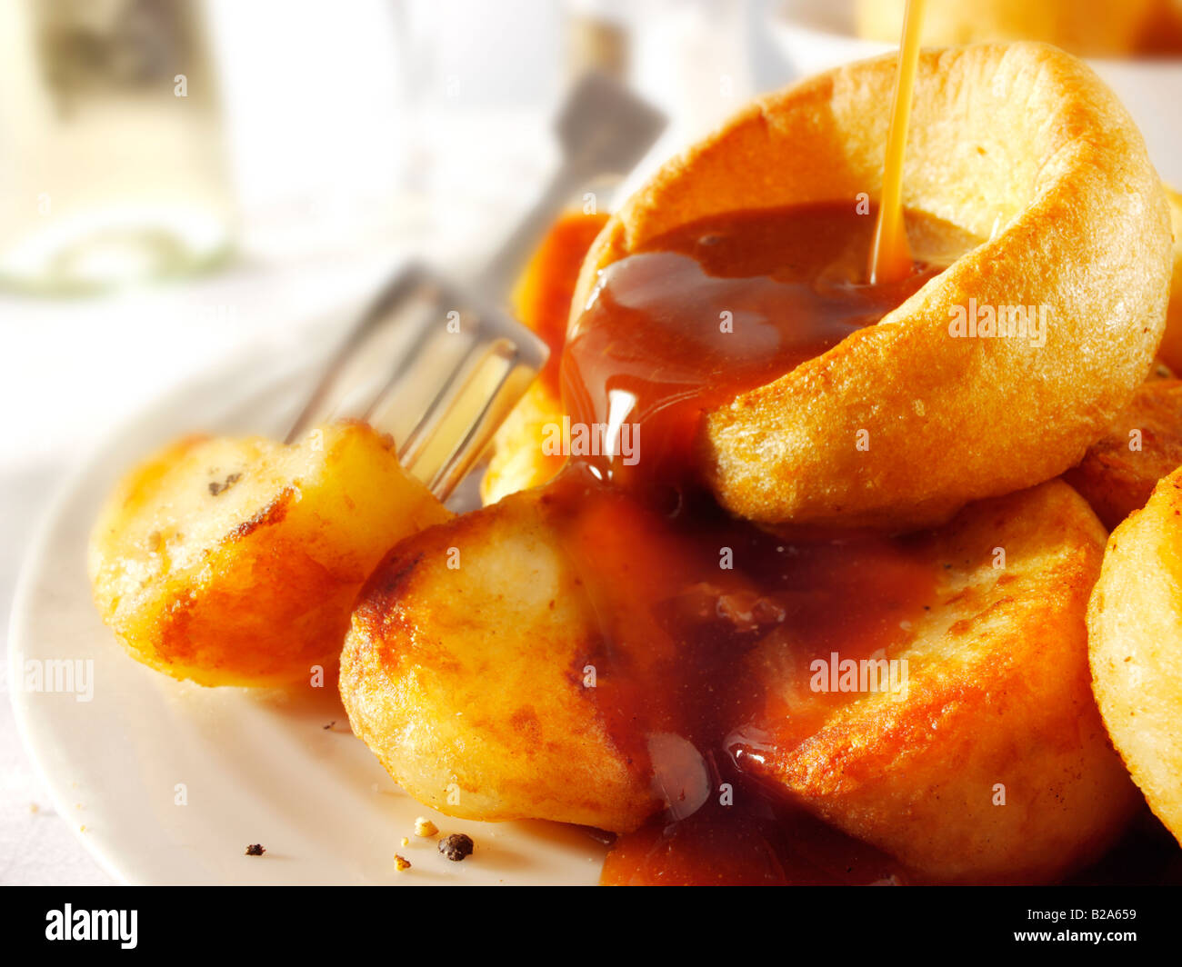 Yorkshire puddings with onion gravy Stock Photo Alamy