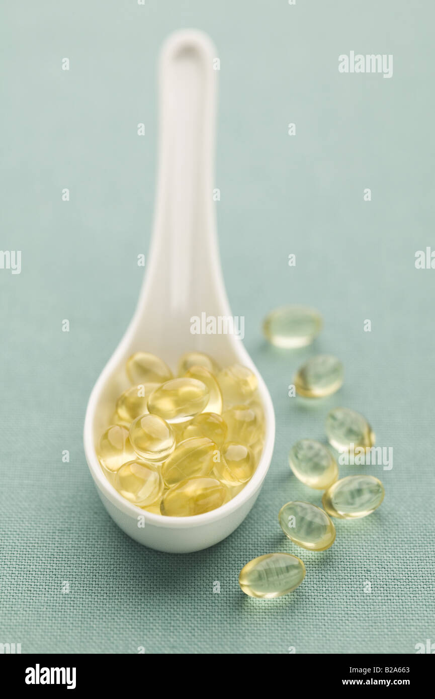 A spoon filled with health supplements Stock Photo Alamy