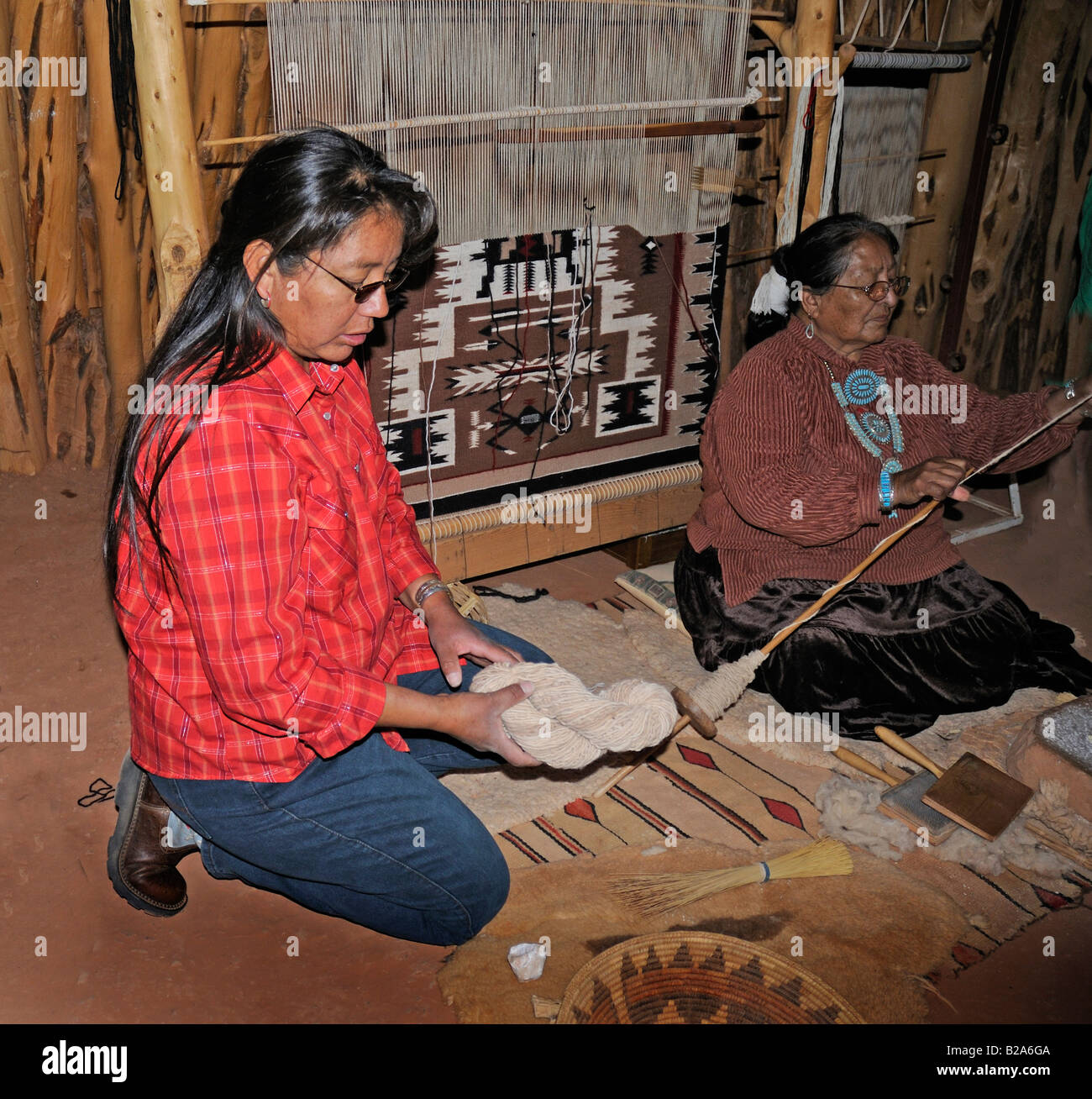 Spinning and weaving techniques in Navajo Hogan in Monument Valley, Navajo Tribal Lands, Utah