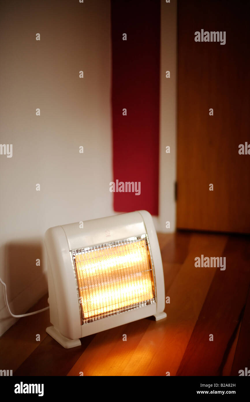 Infra red electric lamp heater on floor Stock Photo