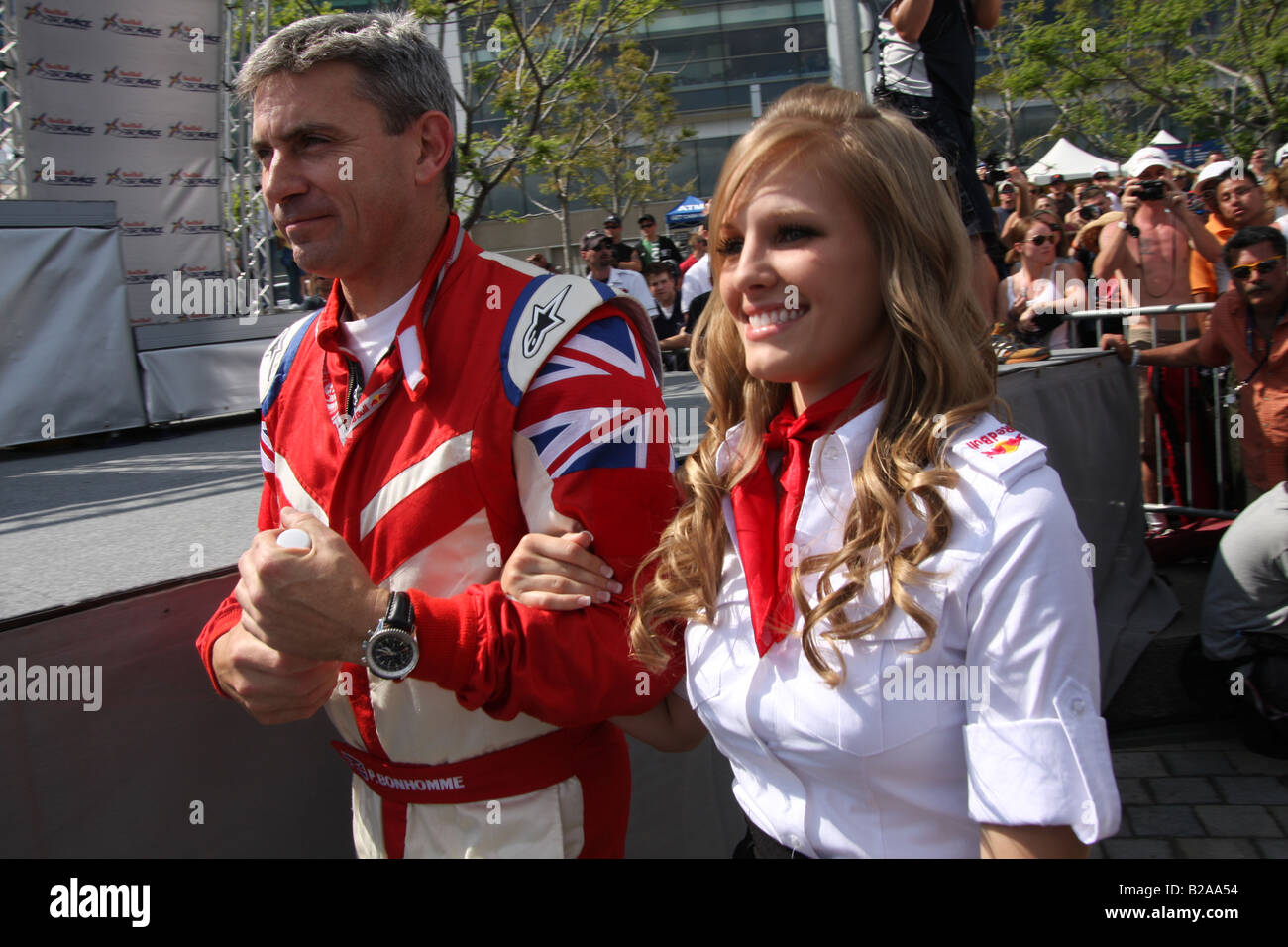 Paul Bonhomme walks with Red Bull Flight Girl to the awards ceremony for the Red Bull Air Race World Series in Detroit, MI. Stock Photo