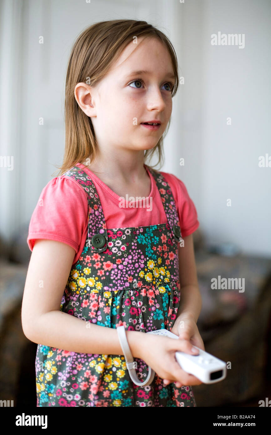 Young girl holding a Nintendo Wii controller Stock Photo