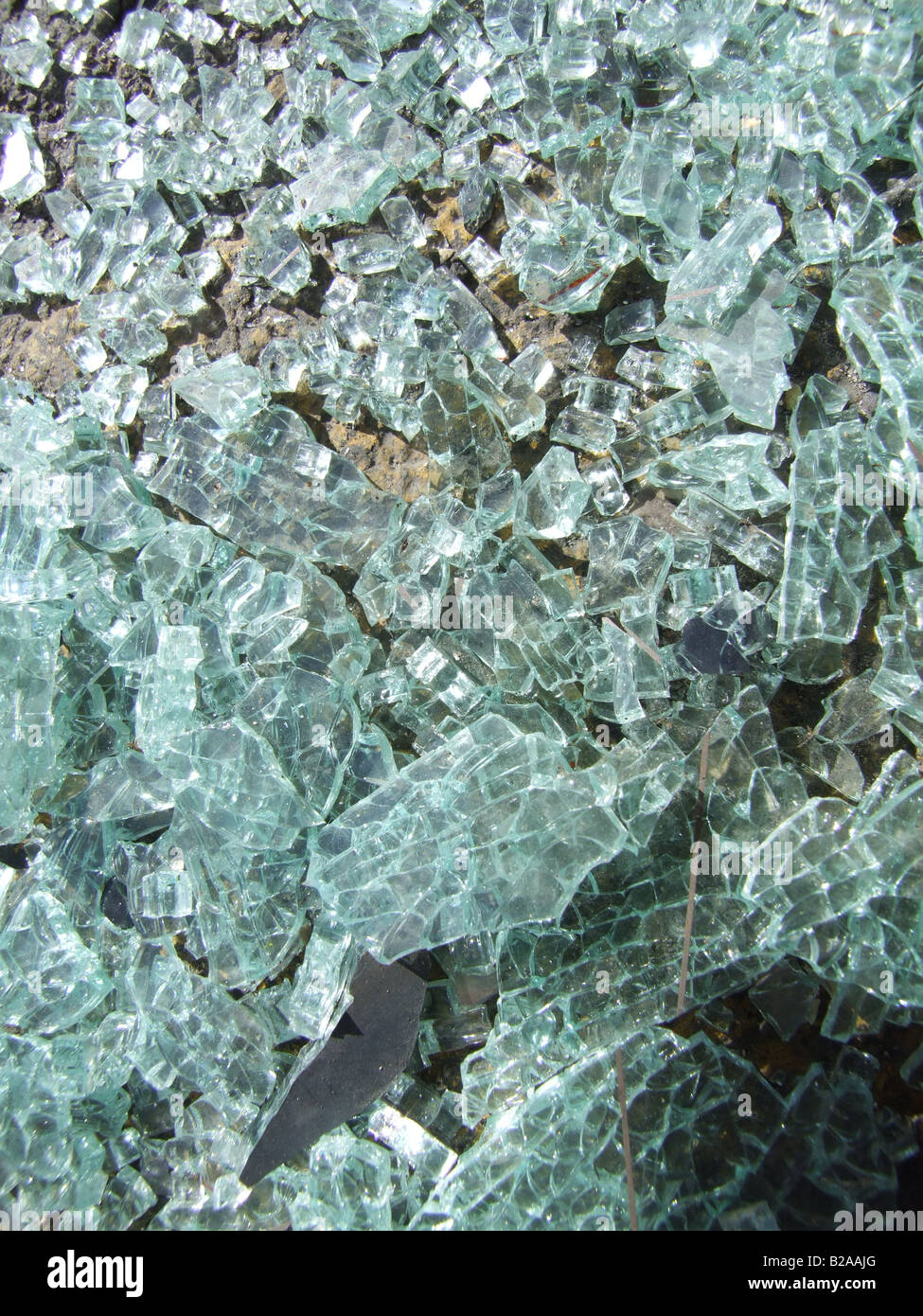 glass from smashed car window on road surface Stock Photo