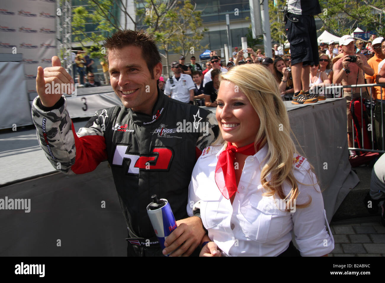 Hannes Arch walks with Red Bull Flight Girl to the awards ceremony for the Red Bull Air Race World Series in Detroit, MI. Stock Photo