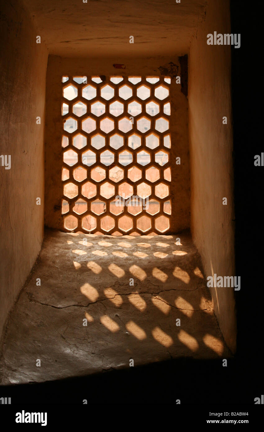 Sunlight streaming through carved stone window Jaigarh Fort Amber Rajasthan India 2007 Stock Photo
