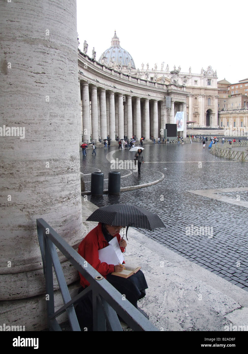 people with umbrellas in rain in vatican, rome Stock Photo Alamy