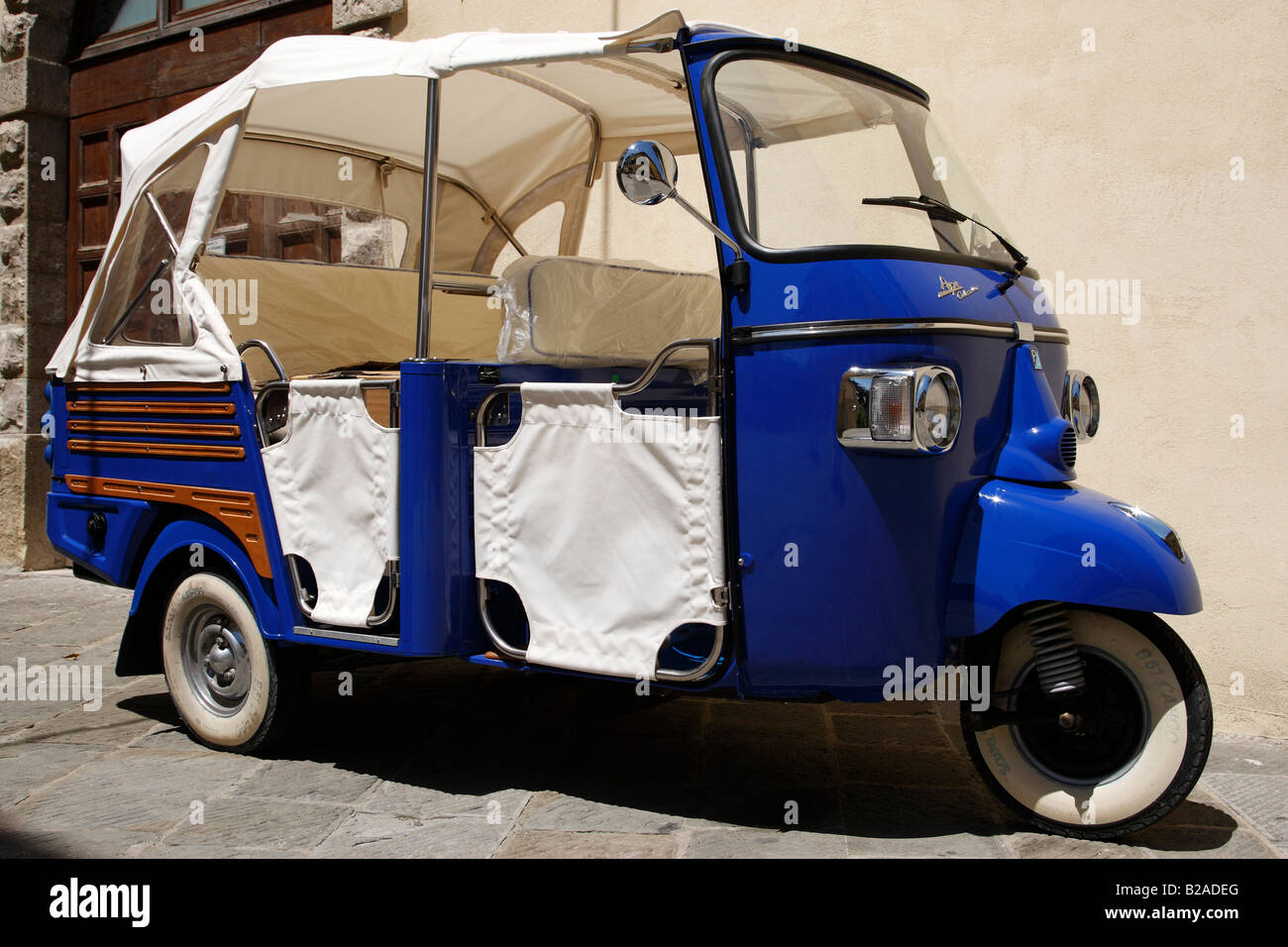 blue piaggio ape calessino outside a shop along via roma radda in chianti tuscany italy europe Stock Photo