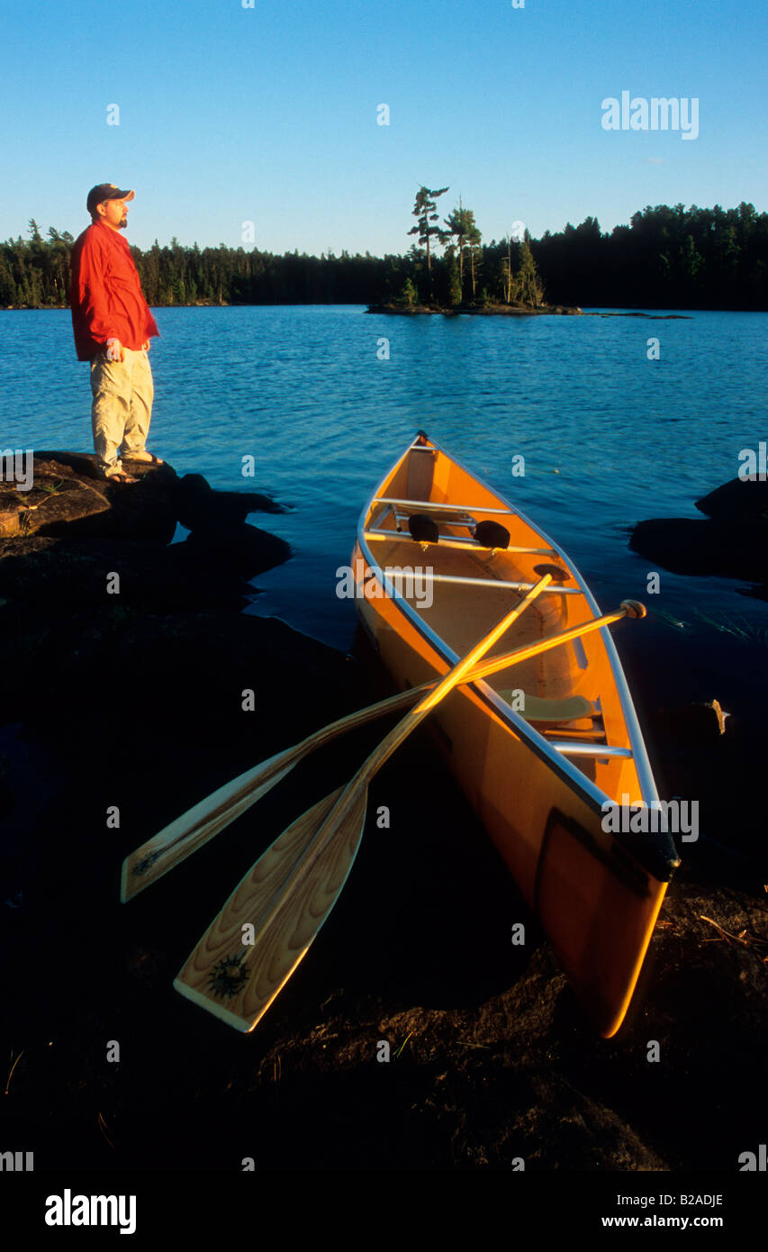 Man and Canoe on Cummings Lake, Boundary Waters Canoe Area, Minnestoa Stock Photo