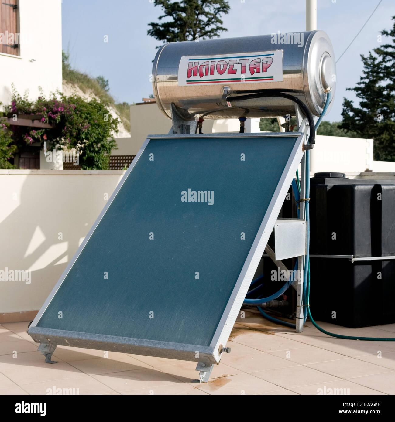 Roof mounted solar panel for domestic water heating. Stock Photo