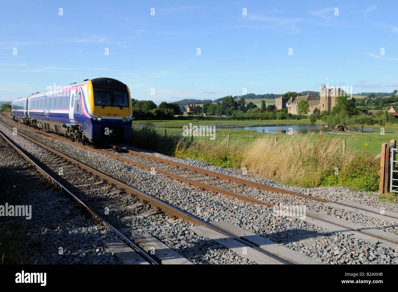 Arriva passenger train passing Stokesay Castle Shropshire UK Stock Photo