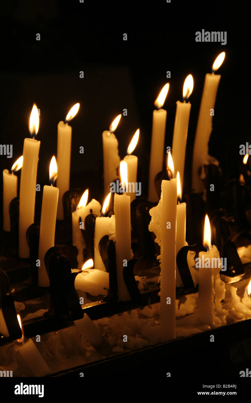 many lit candles in dark room in church Stock Photo Alamy