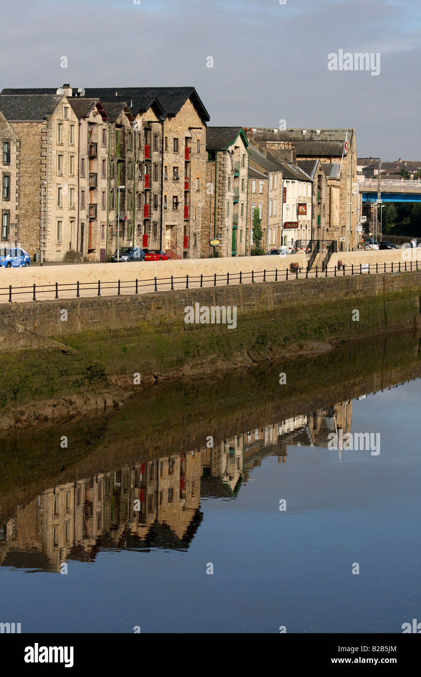 Old Warehouses on St George's Quay, Lancaster and reflections in the River Lune Stock Photo