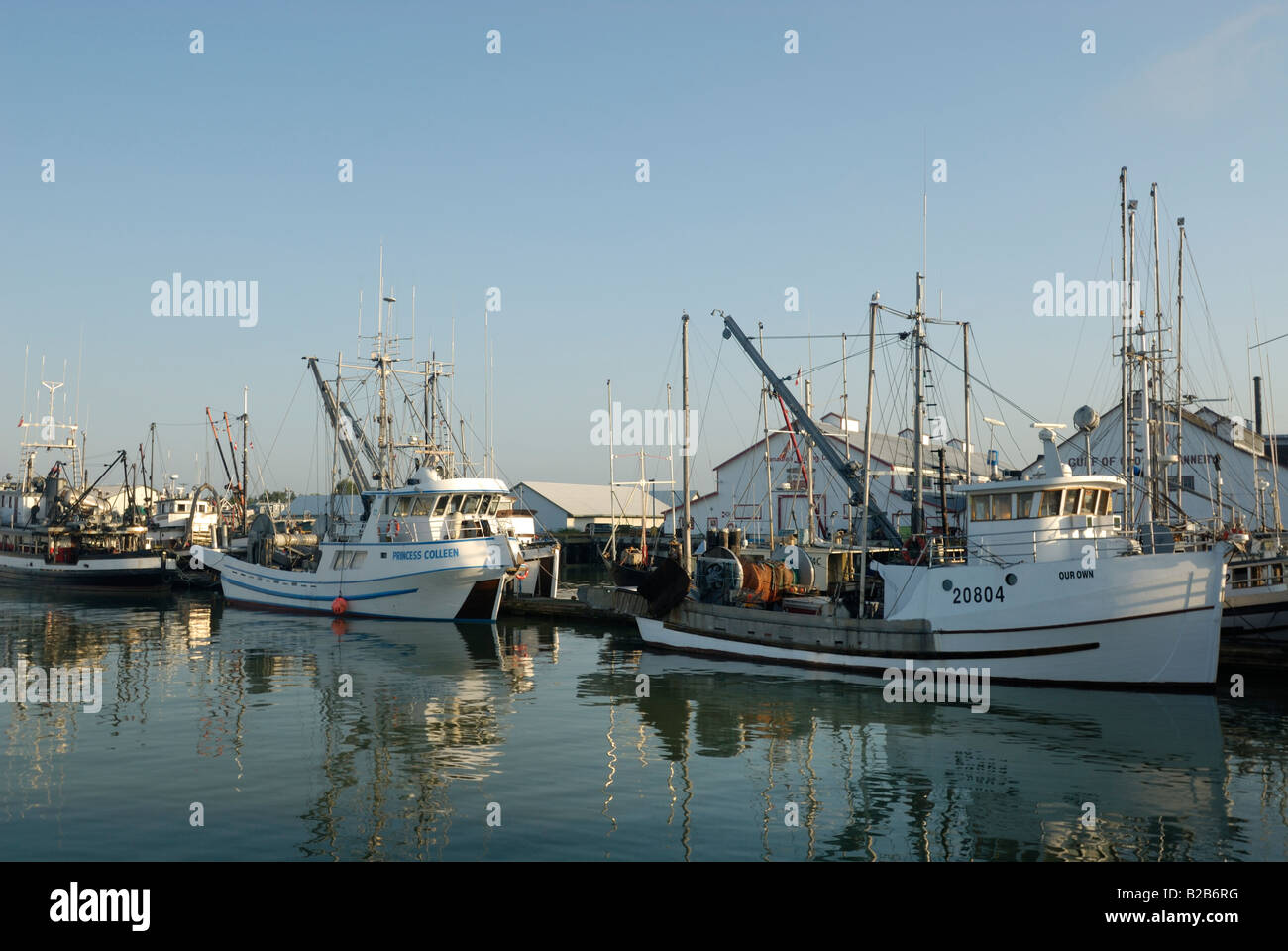 Fishing Boats moored In a Harbour Stock Photo - Alamy