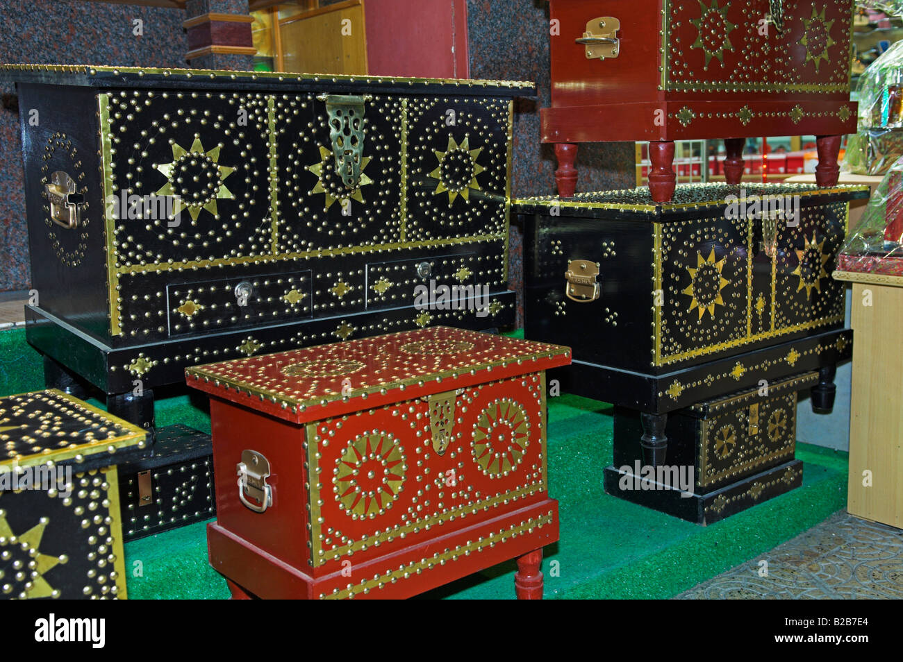 Decorated linen chests on display in souq of Mutrah old Muscat Oman