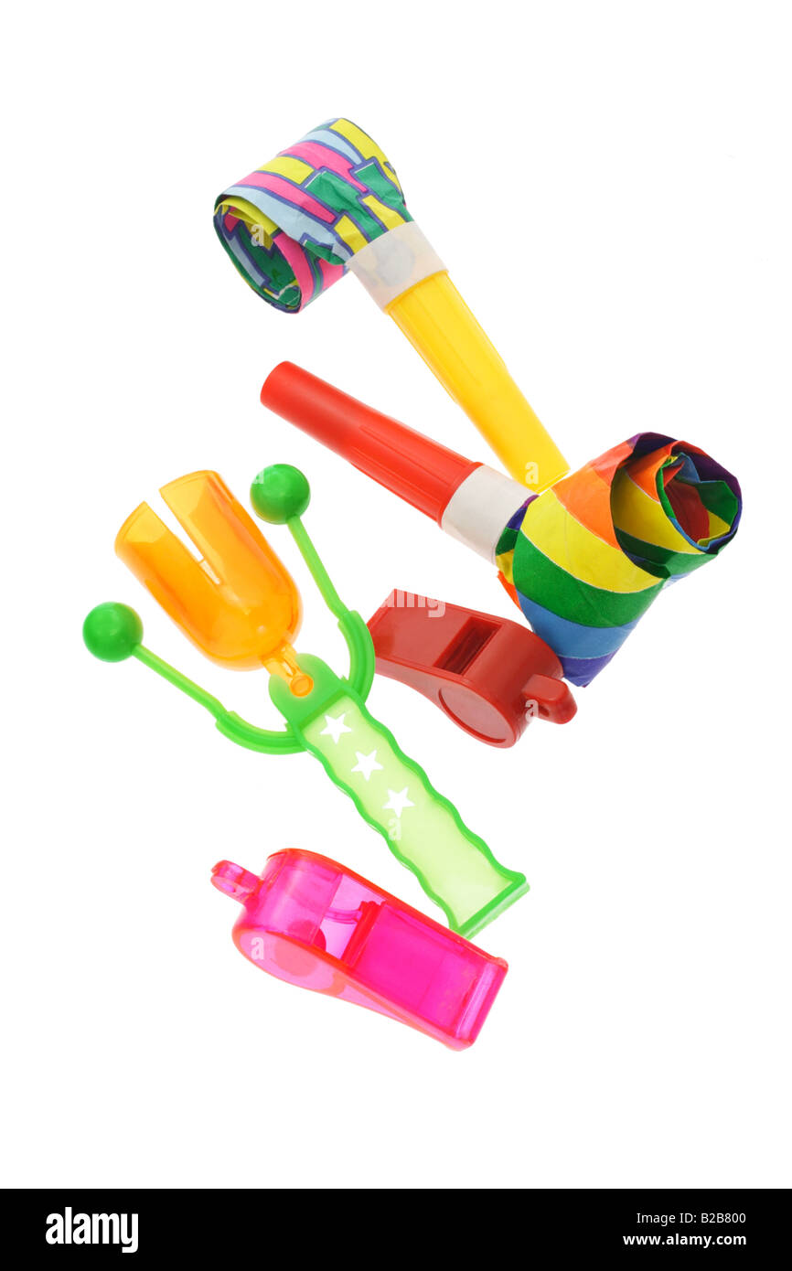 Colorful party horn blowers whistles and click clack on white Stock ...