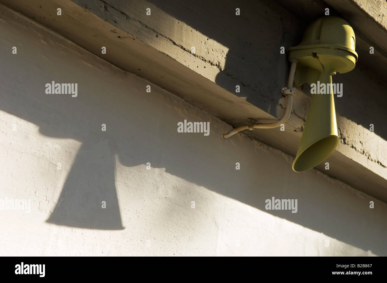 Gray alarm hooter mounted in the wall Stock Photo