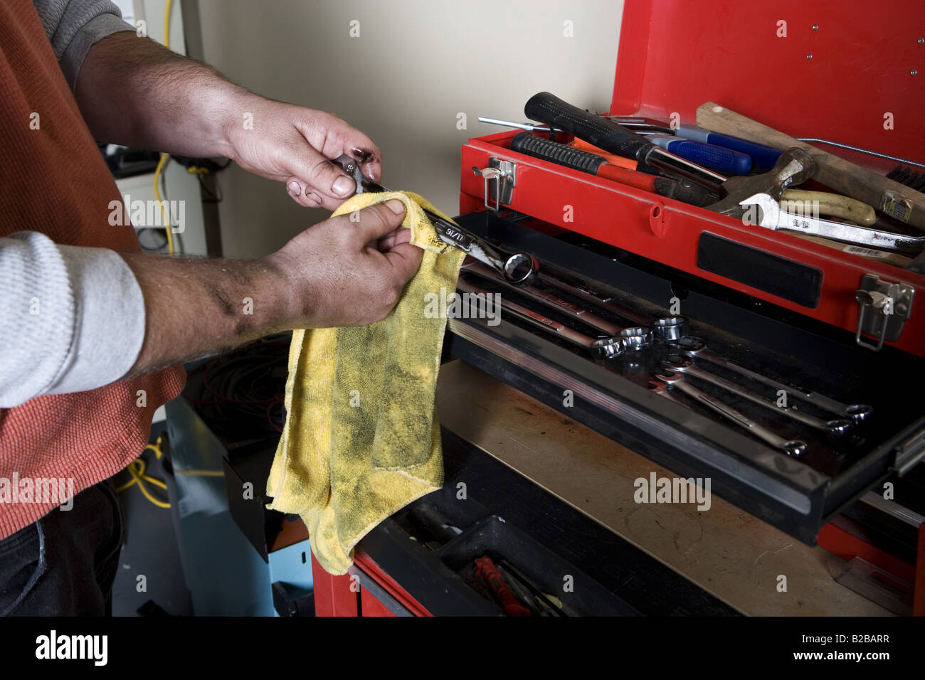 Auto mechanic cleaning wrench with cloth Stock Photo Alamy
