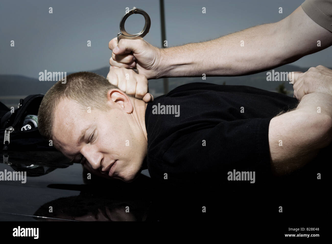 Police and handcuffed man hires stock photography and images Alamy