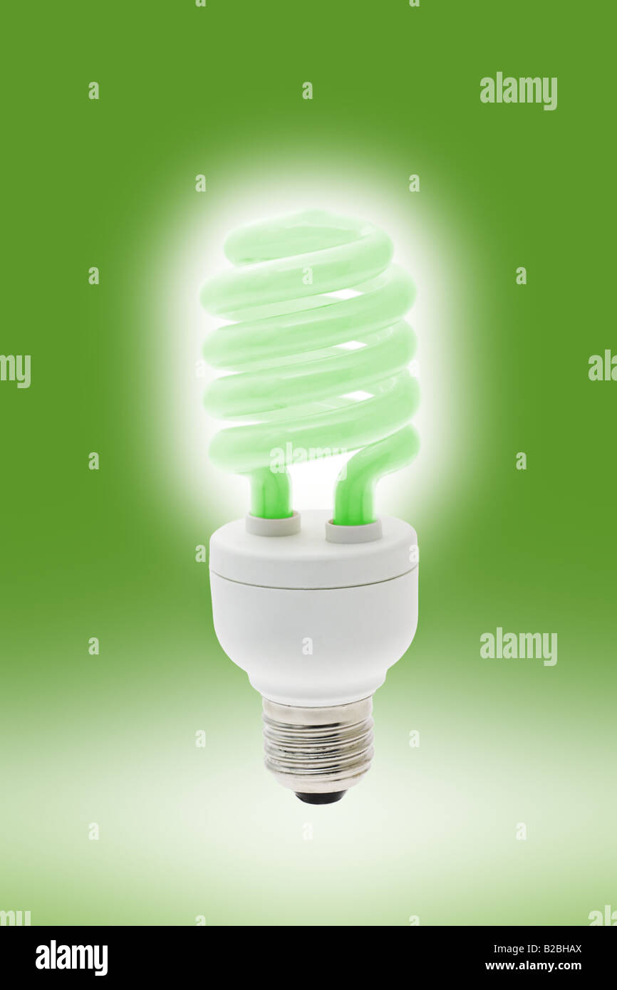 Glowing cool green energy saving light bulb Stock Photo - Alamy