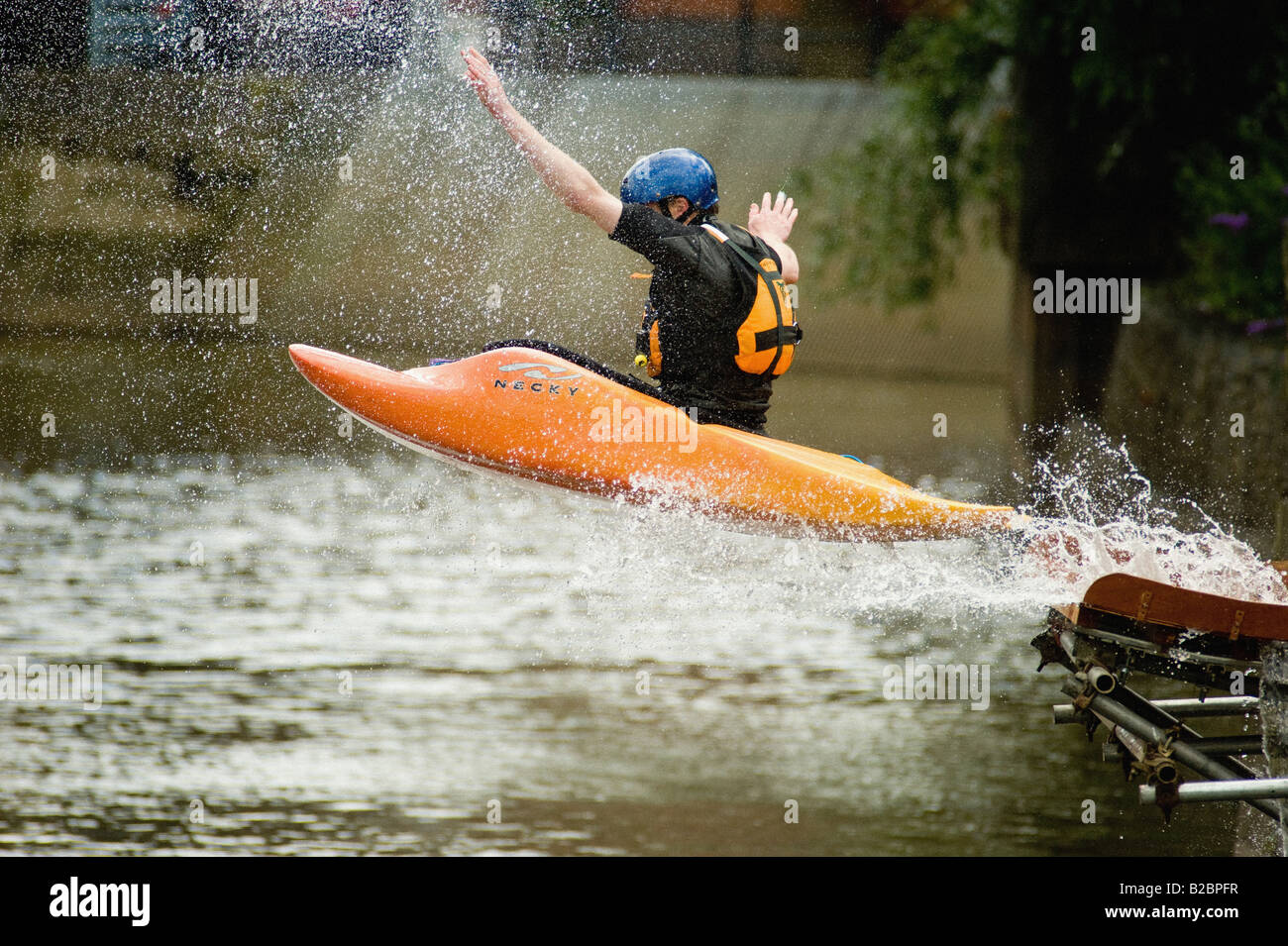 Kayaker performing an aerial manoeuvre on the river Foss in York, UK Stock Photo