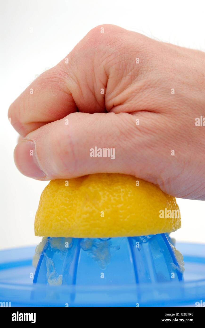 Lemon being wrung out Stock Photo