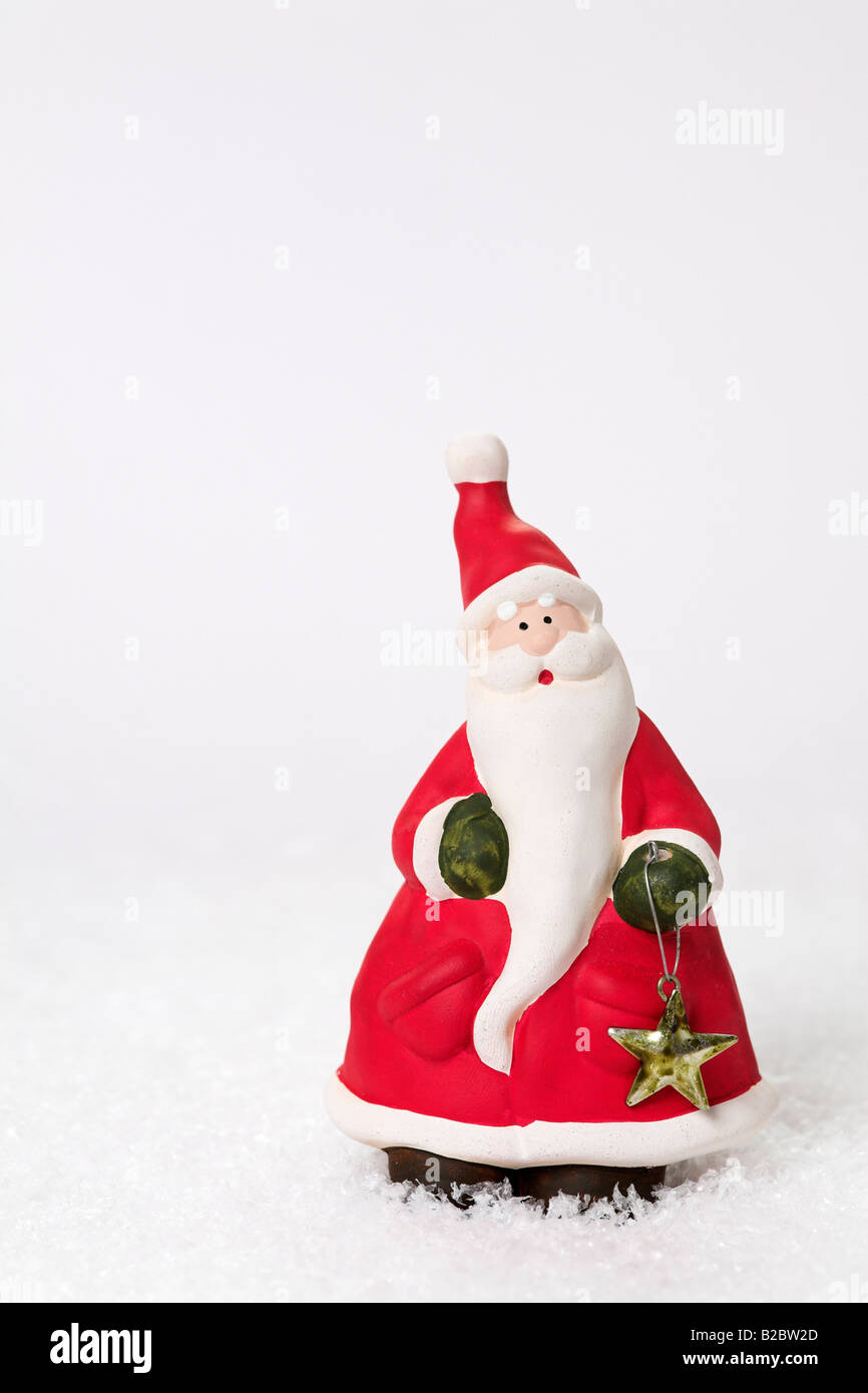 Father Christmas on artificial snow Stock Photo