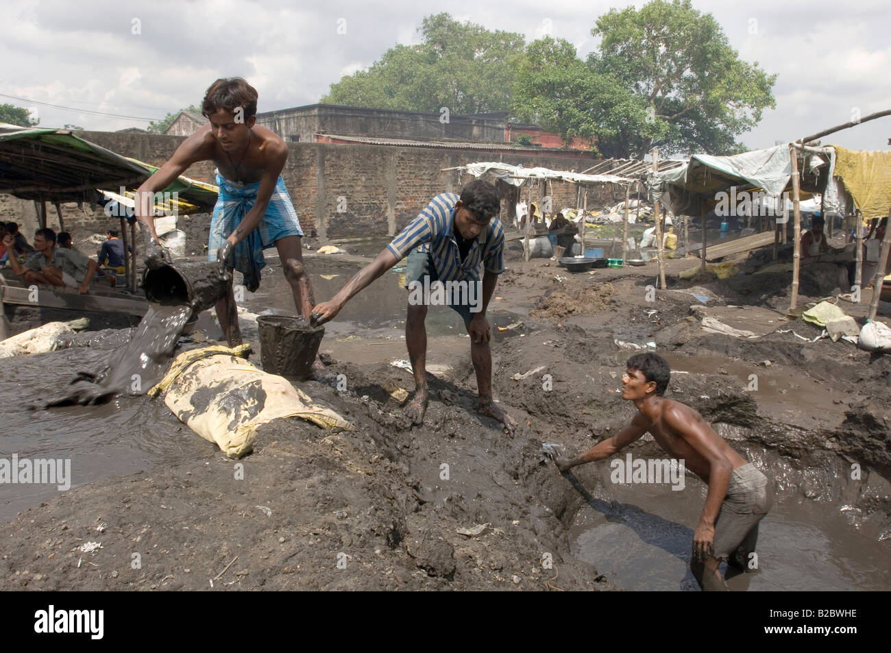 Many slum dwellers live off recycling industrial waste. Day labourers
