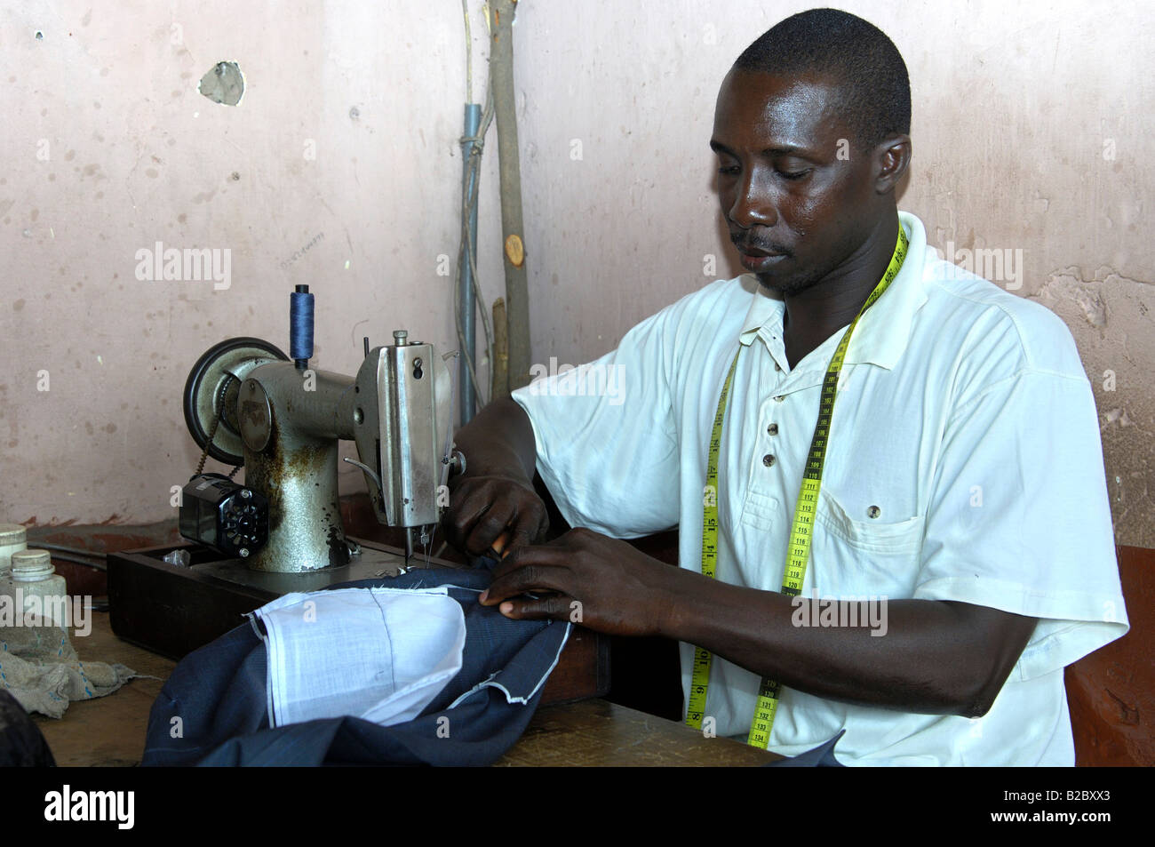 Mr. Kwadwo Koranteng, a tailor in Akropong-Akwapim, at work, Eastern region, Republic of Ghana, West Africa, Africa Stock Photo