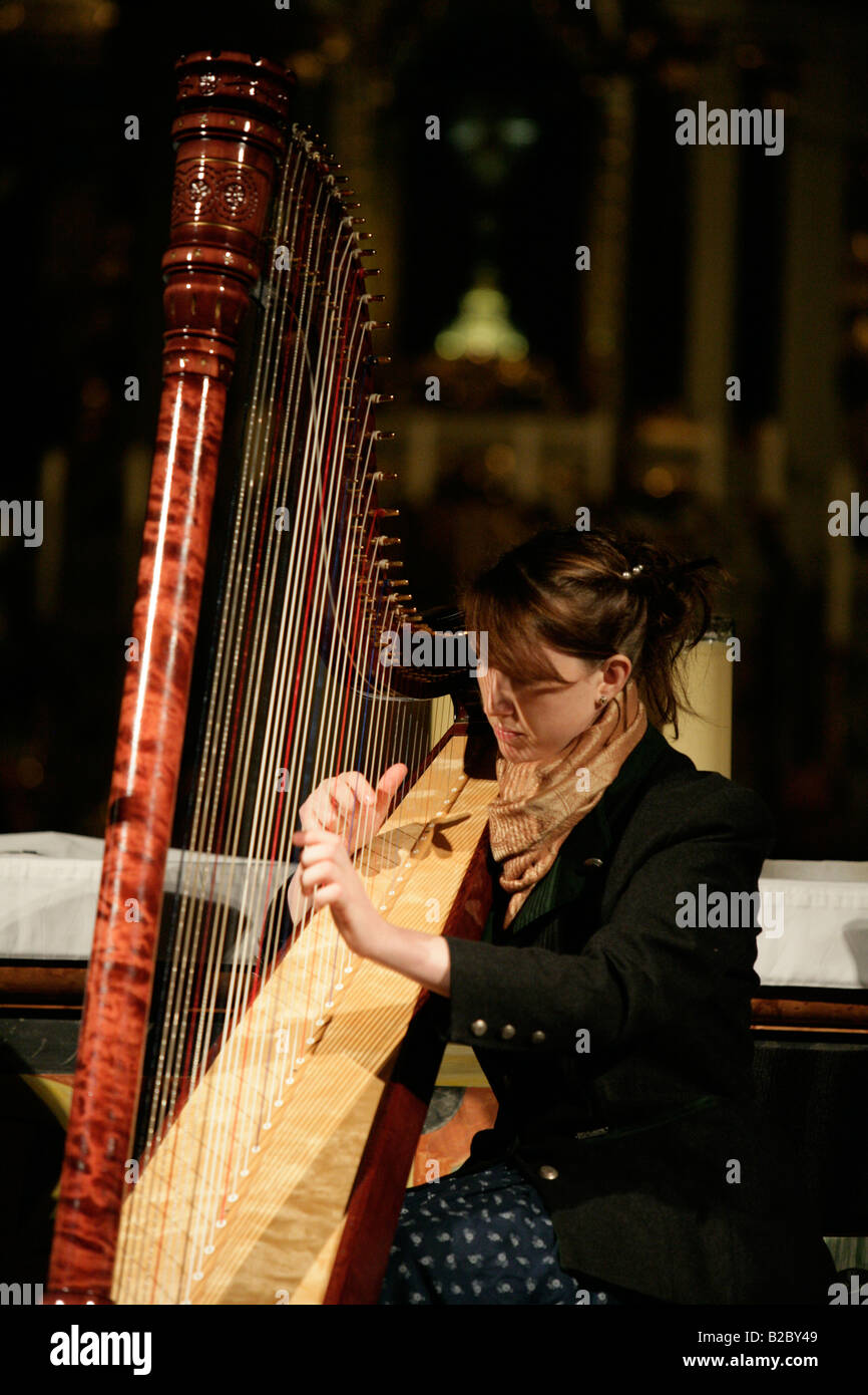 Harpist playing hi-res stock photography and images - Alamy