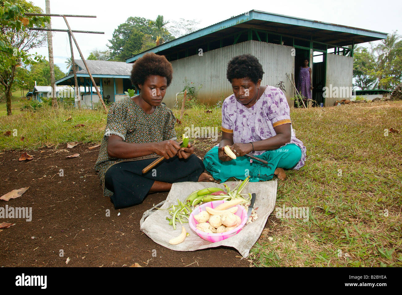 Women cooking, Logaweng, Papua New Guinea, Melanesia Stock Photo