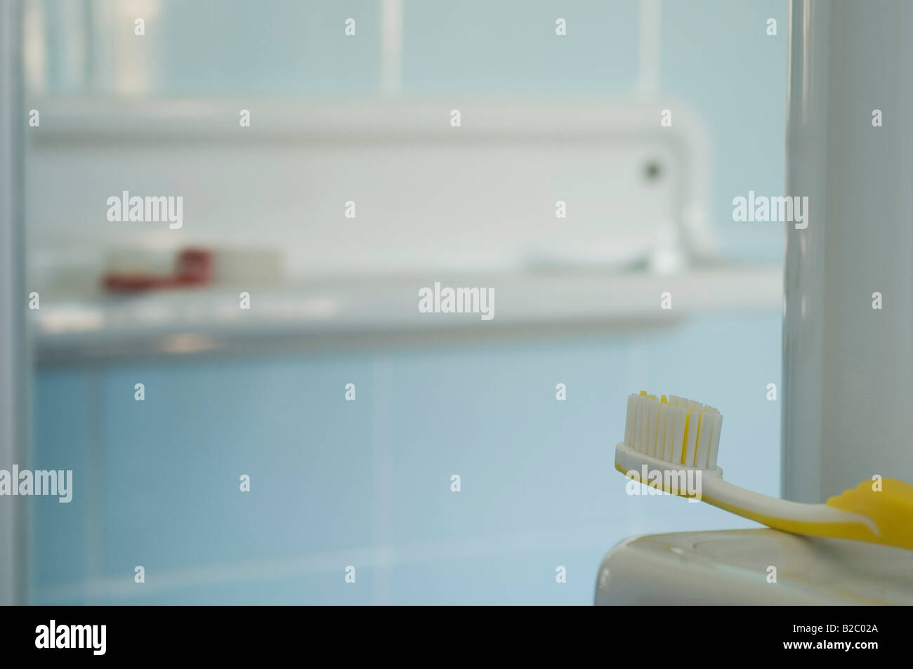 Toothbrush on a shelf in a hotel bathroom Stock Photo Alamy