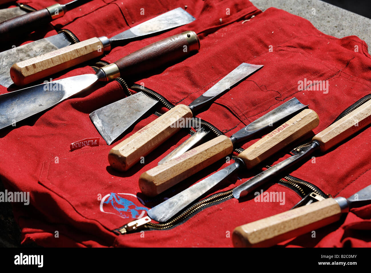 Woodcarving tools, spread out on a red cloth Stock Photo Alamy