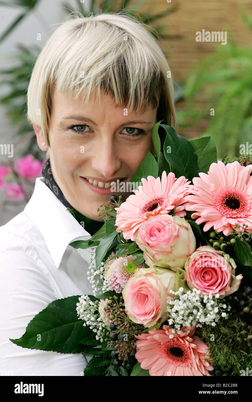 Young woman with a bouquet of flowers Stock Photo