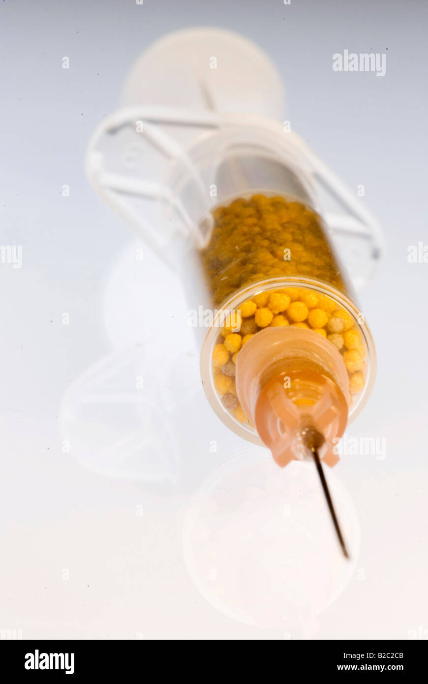 Injection filled with vitamins Stock Photo - Alamy