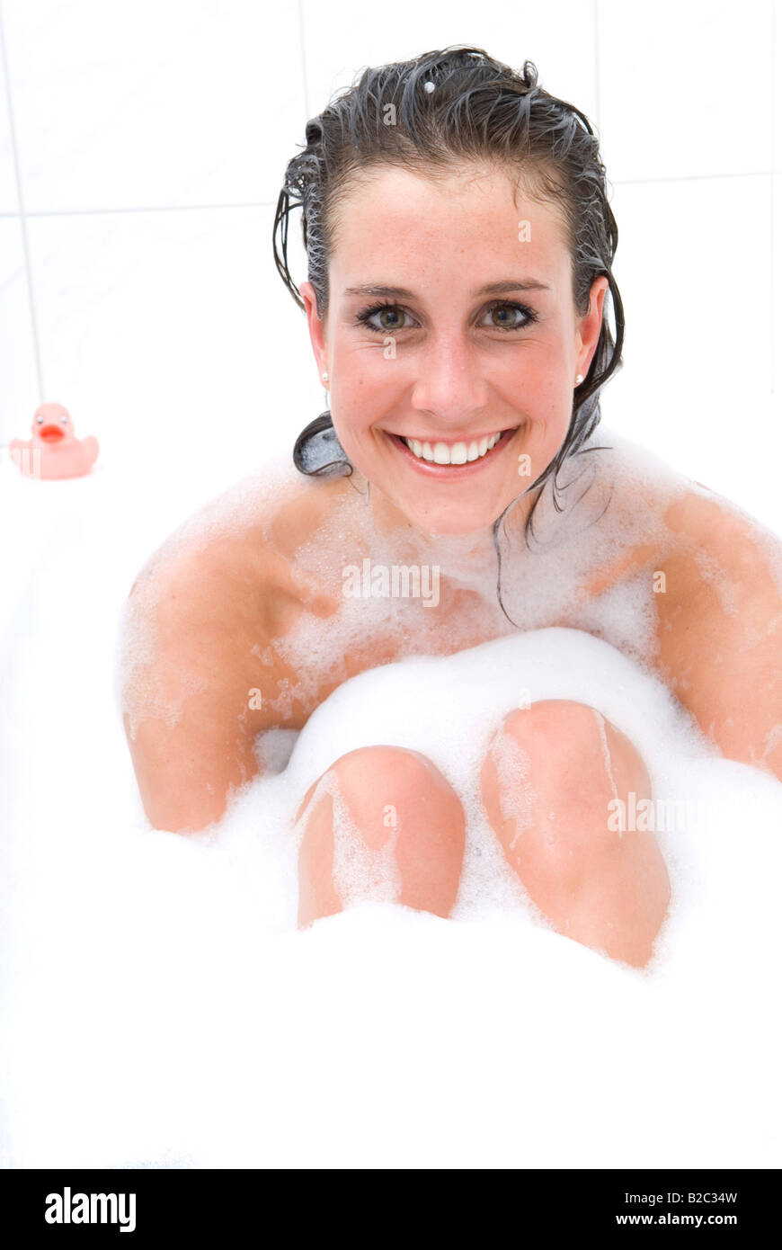 Young woman relaxing in the bathtub Stock Photo