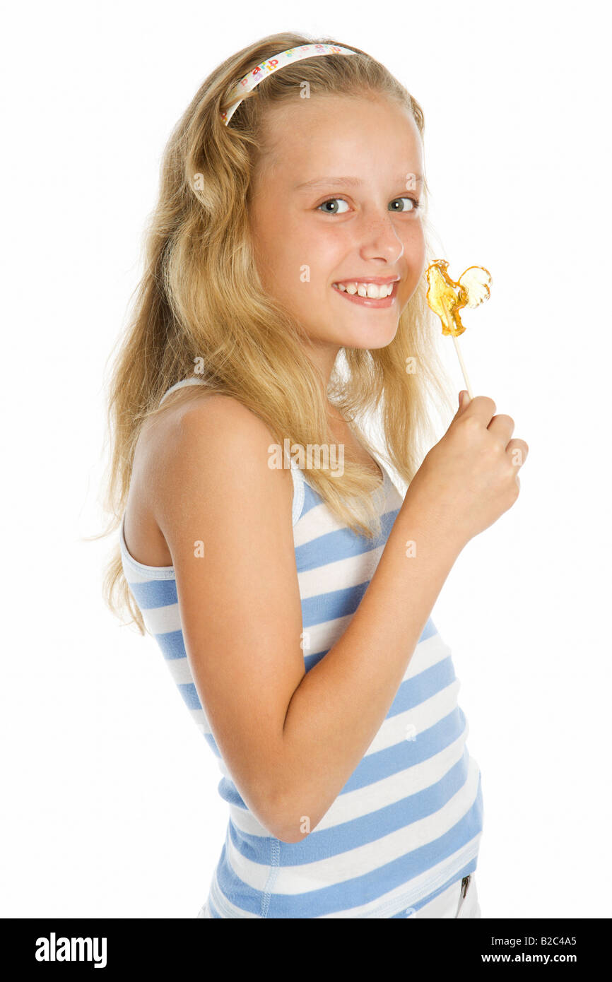 Beautiful young smiling girl with lollipop candy Stock Photo
