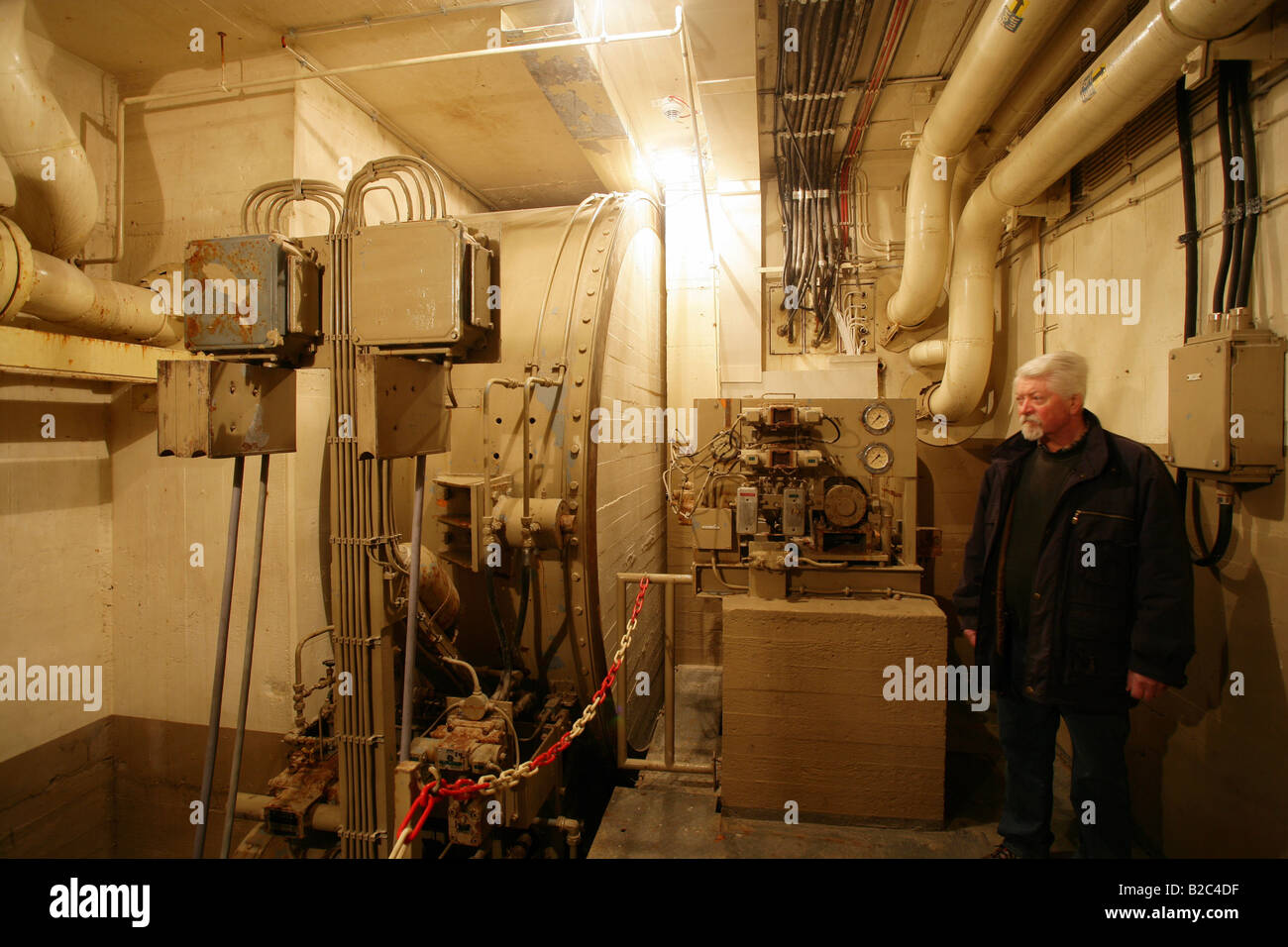 Employees observing the control room in the museum of the former Marienthal government bunker near Ahrweiler Stock Photo