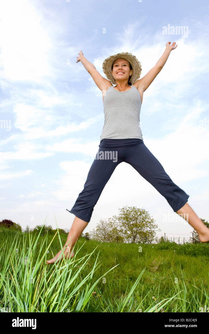 young woman cutting a caper Stock Photo Alamy