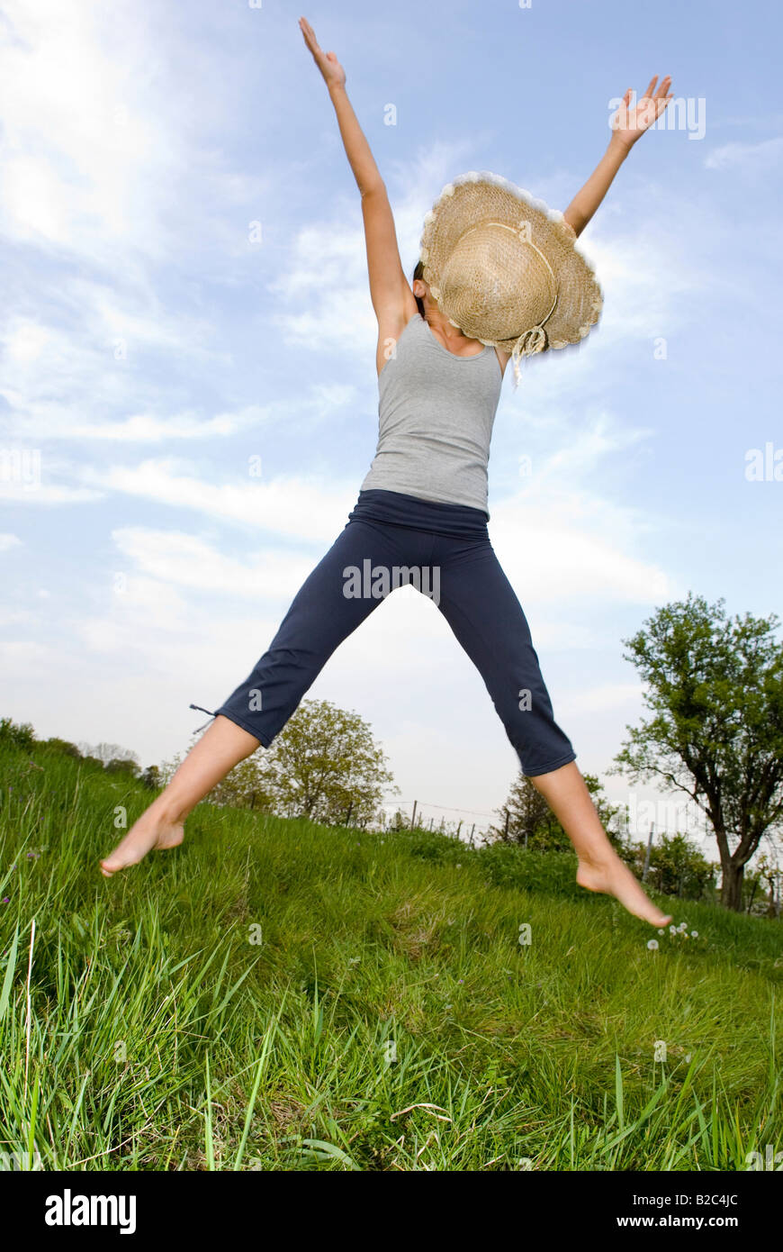 young woman cutting a caper Stock Photo Alamy