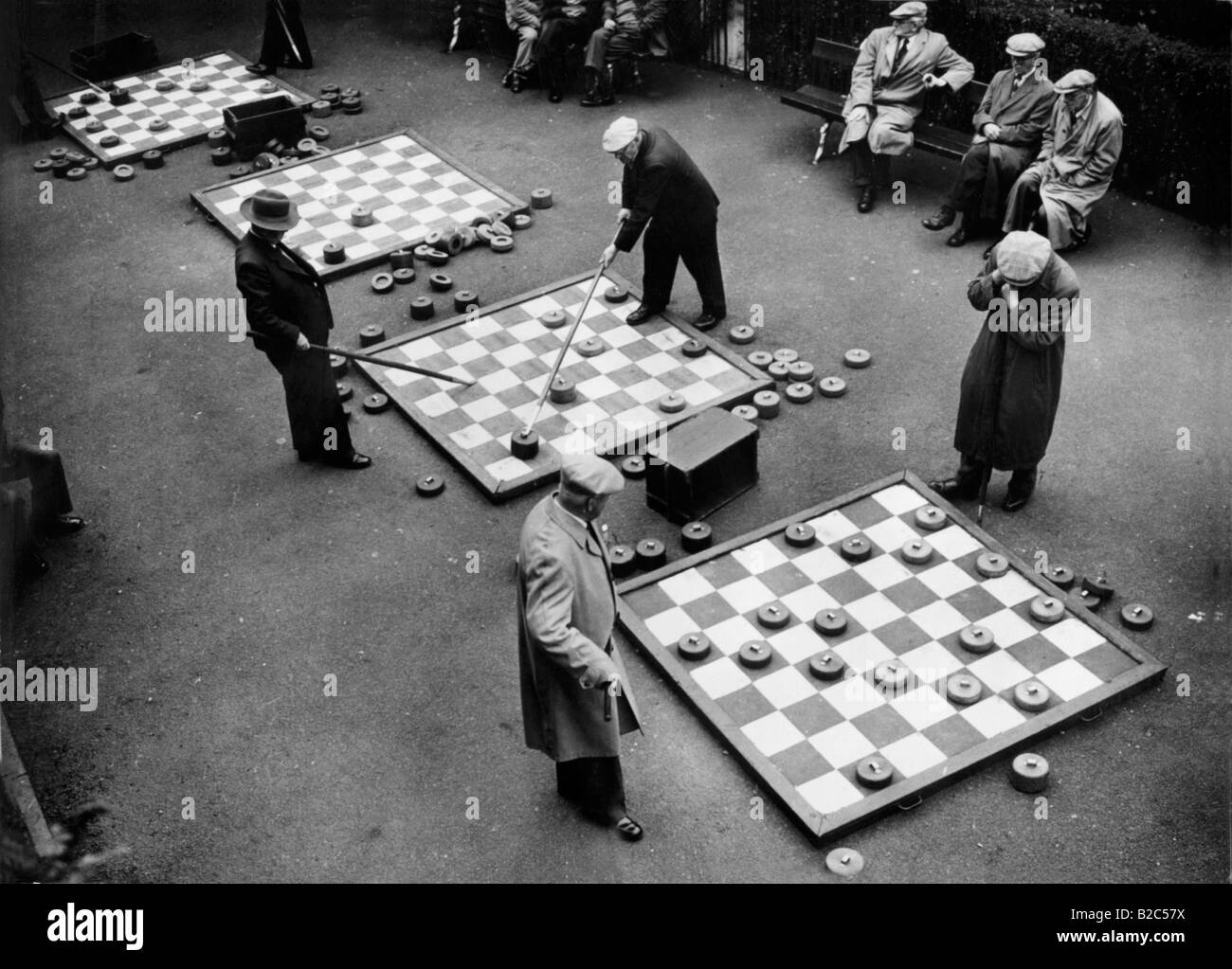 Men playing drafts, historical photo, circa 1920 Stock Photo
